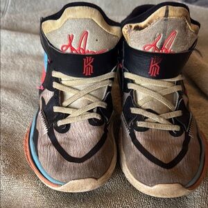 Nike Kids' Black and Tan Sneakers with Blue Accents